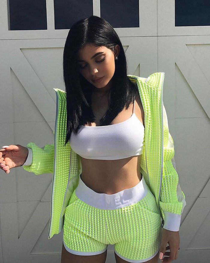 Sultriest Fashion Choices By Kylie Jenner neon shorts jacket white sports bra